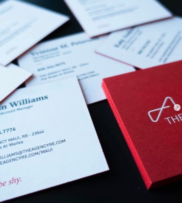 Stack of AG Designs business cards for real estate agents